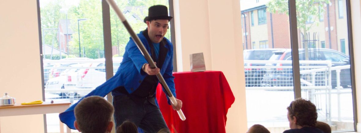 Tom Tricks performing his magic show for a kids party
