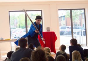 Tom Tricks performing his magic show for a kids party